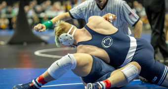 PSU leads team race after Day 1, Iowa sends 7 to quarterfinals
